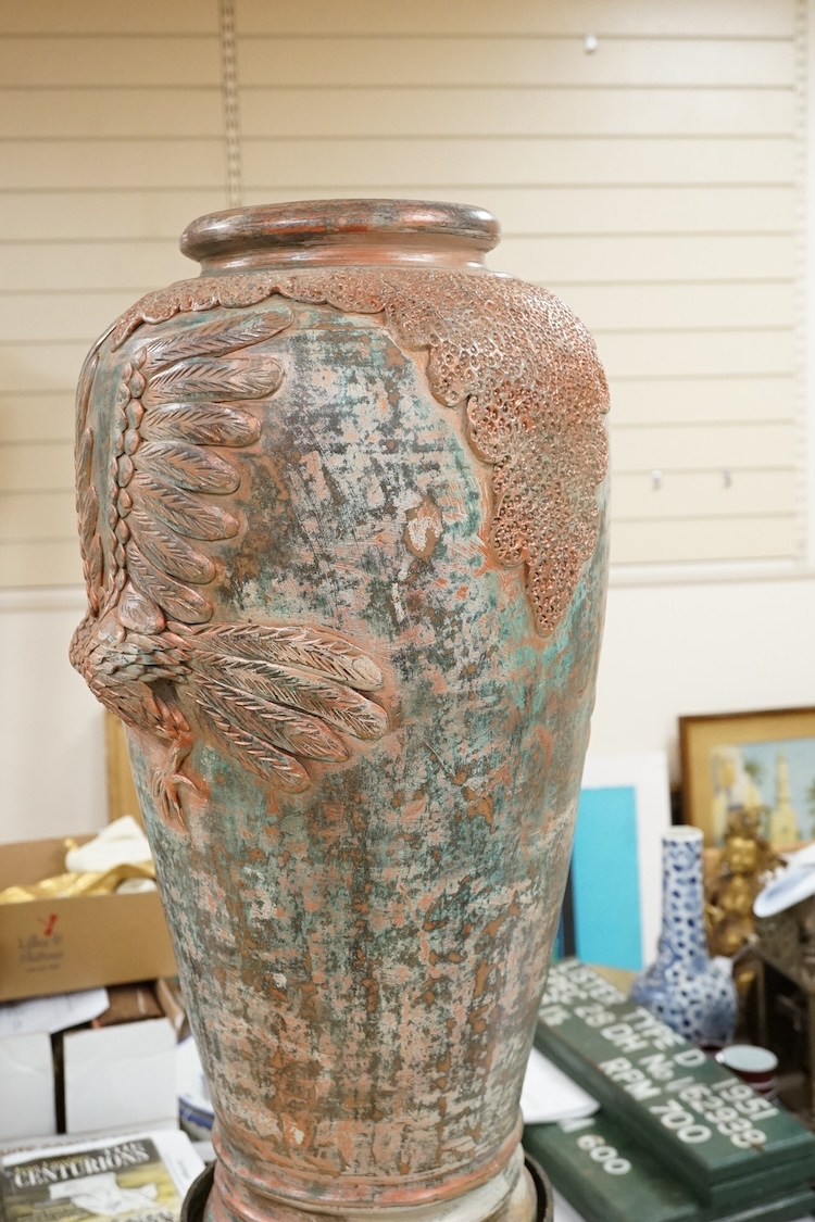 A large Chinese terracotta jar on archaistic stand, 83cm high